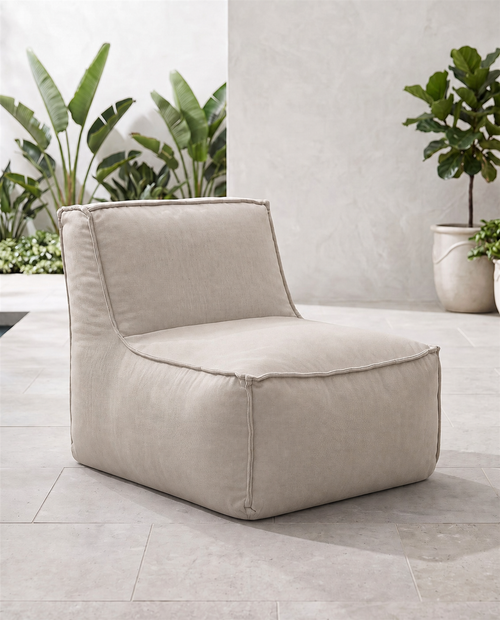 Cove outdoor lounge chair in Cashmere Sunbrella fabric on a patio