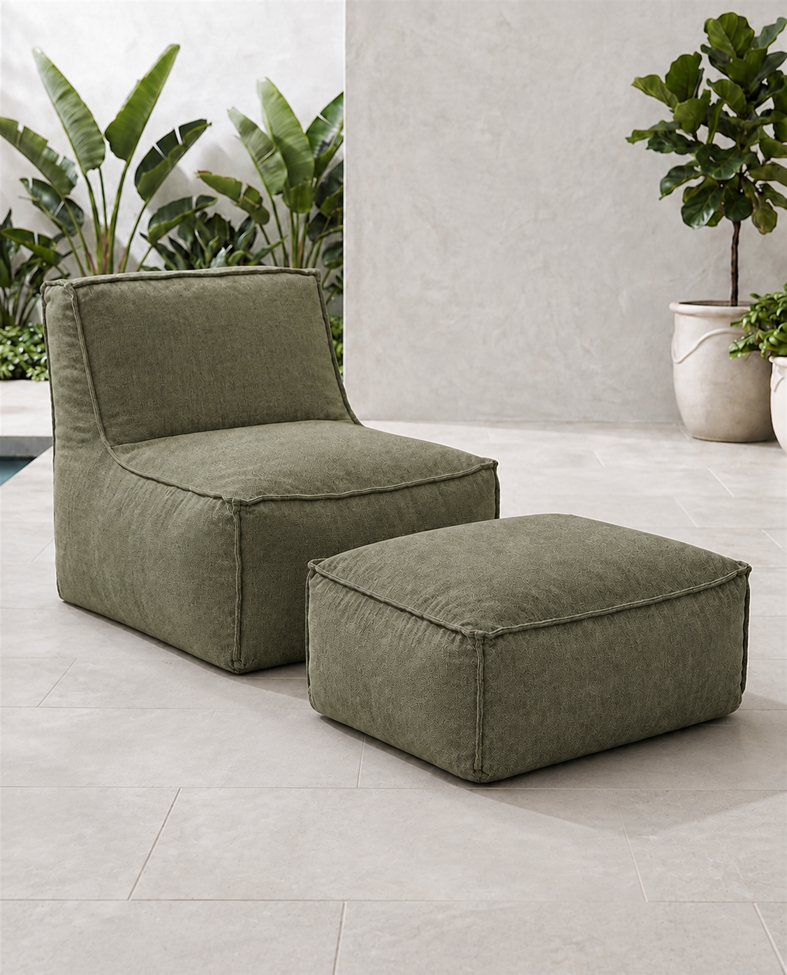 Cove outdoor lounge chair and matching ottoman in Willa Frond Sunbrella fabric