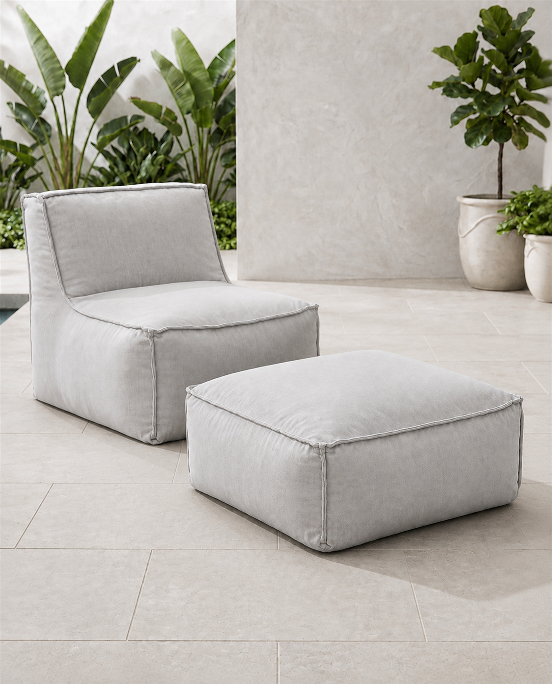 Cove outdoor lounge chair and matching ottoman in Canvas Granite Sunbrella fabric