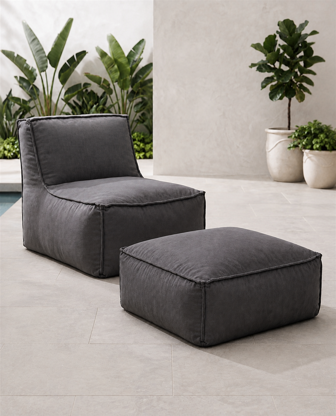 Cove outdoor lounge chair and matching ottoman in Charcoal Sunbrella fabric