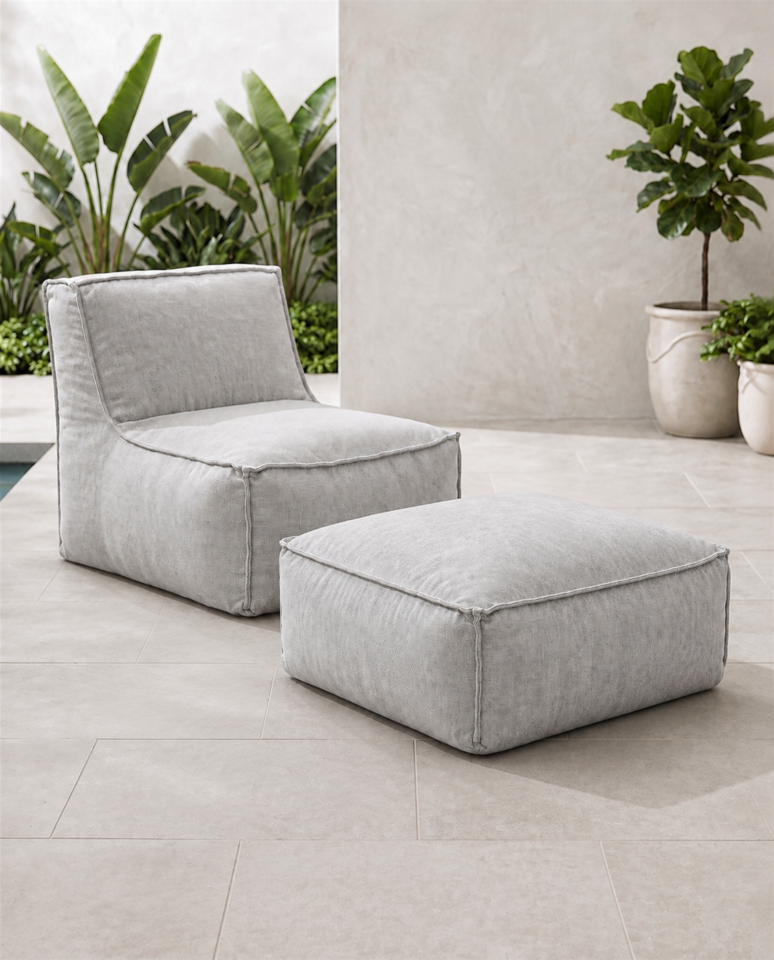 Cove outdoor lounge chair and matching ottoman in Pebble Sunbrella fabric