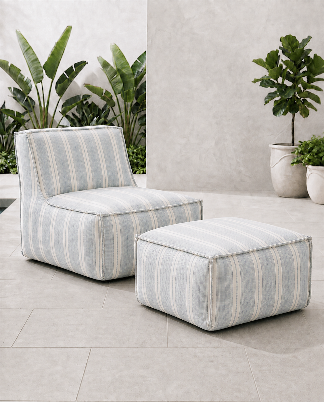 Cove outdoor lounge chair and matching ottoman in blue and ivory Dobby Stripe Sunbrella fabric