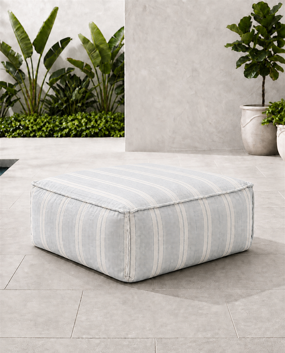 Cove outdoor ottoman in blue and ivory Dobby Stripe Sunbrella fabric