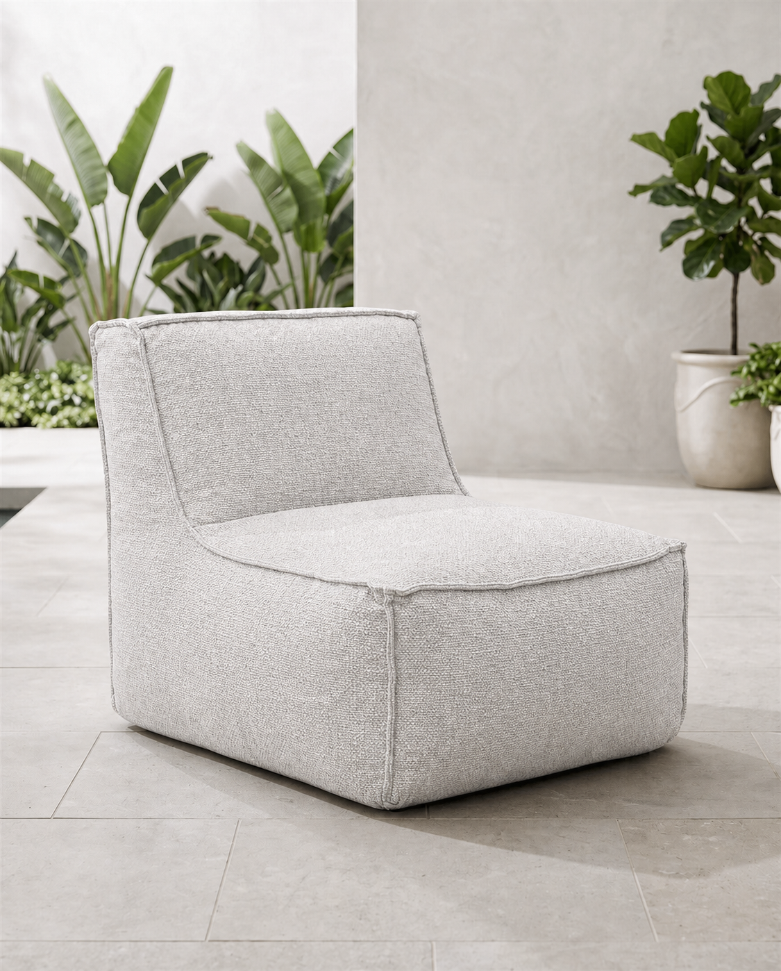 Cove outdoor lounge chair in Pebble fabric on a tiled patio