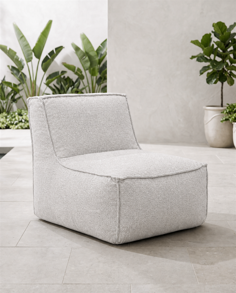 Cove outdoor lounge chair in Pebble fabric on a tiled patio